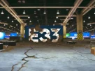 alt_text: A dilapidated convention hall with empty booths and a cracked E3 logo, symbolizing E3's decline.